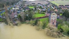 Hotter, wetter winters, hotter, drier summers and impacts to global supply chains could result in losses worth billions of pounds. Pictured: Flooding around the River Severn, Shropshire